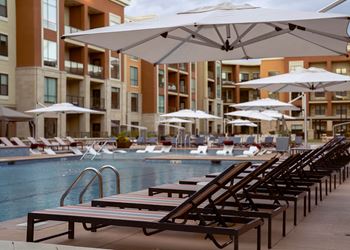 Swimming pool with loungers surrounding and in the pool